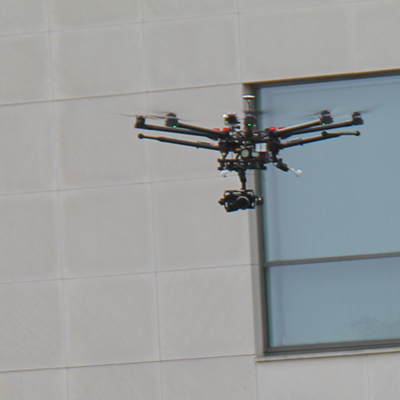 Drone flying near building