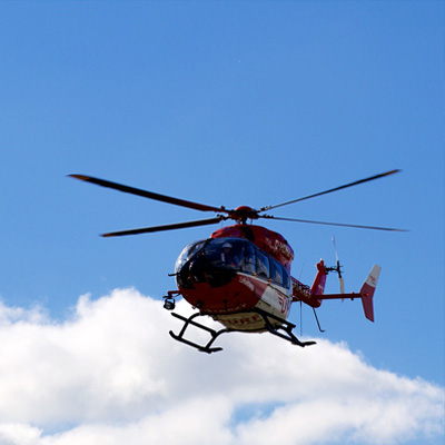 Helicopter in flight on blue sky