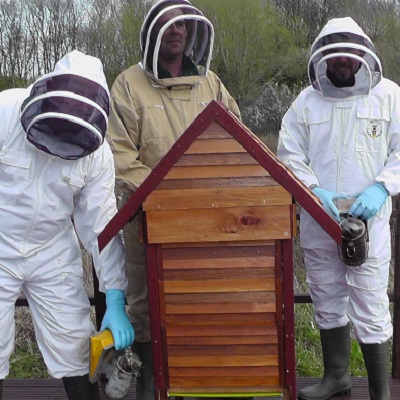 Beekeepers with hive