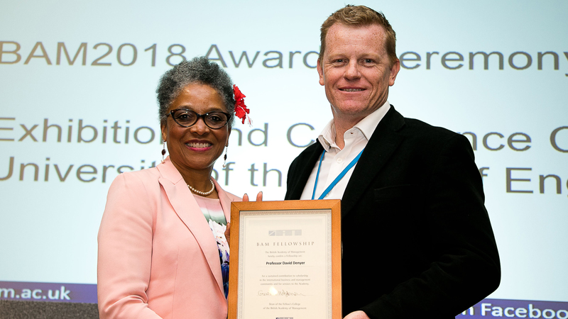 Peaches Golding and David Denyer holding a certificate
