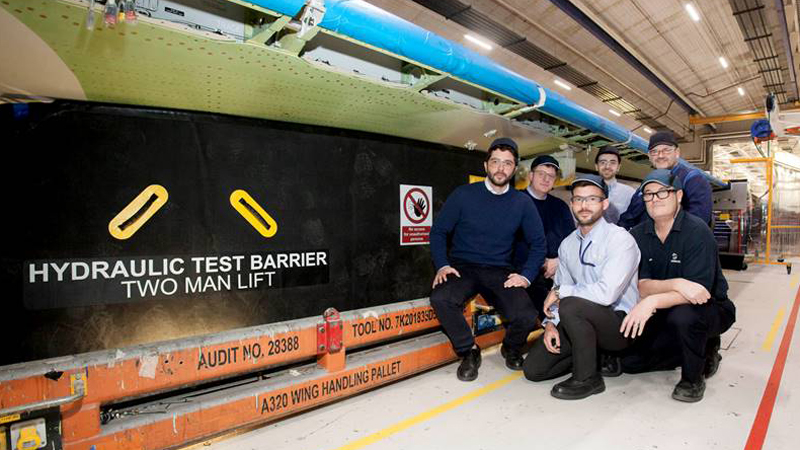 The research team with the inflatable barrier