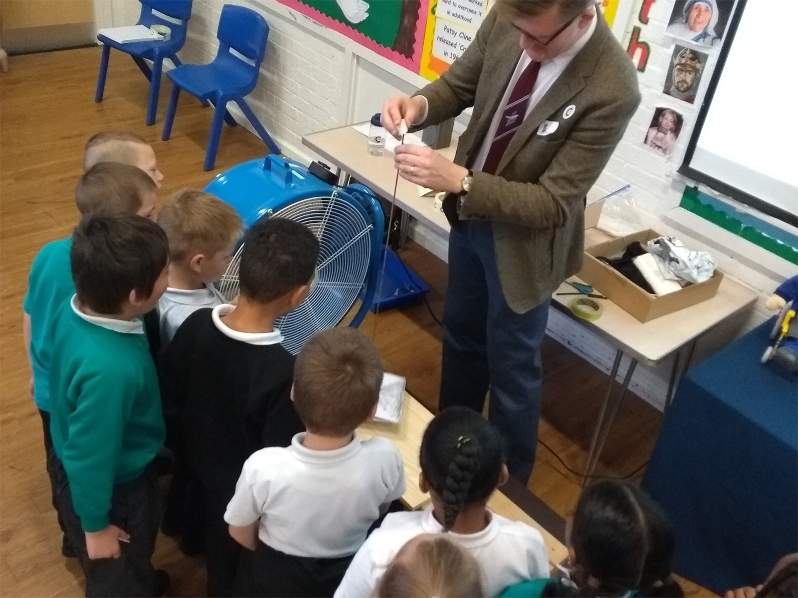 Brooksward School students conducting an experiment with Cranfield lecturer Jack Stockford