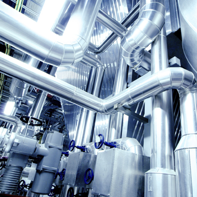 Close up of grey pipes in factory setting