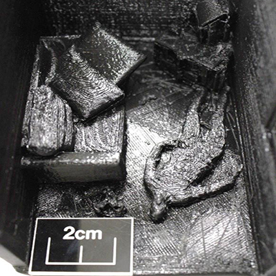 A 3D model of a crime scene. You can see a body on the floor next to a sofa.