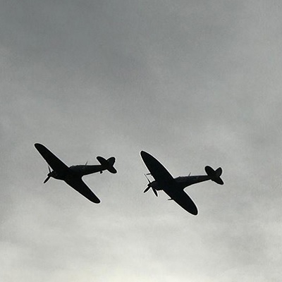 The Hurricane and Spitfire planes flying in the sky