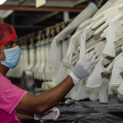 man in glove factory