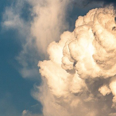 Image of clouds against a blue sky.