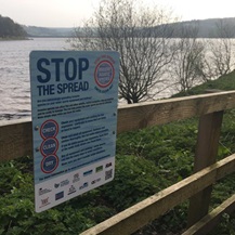 warning sign near lake