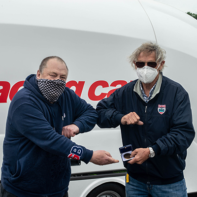 Clive Temple receiving his medal from Adrian Reynard