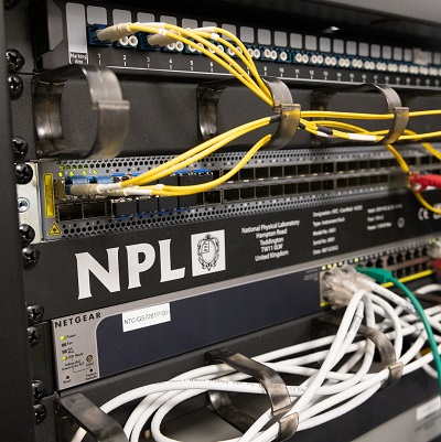 The innovation timing node at Cranfield University, a black box with branding from National Physical Laboratory (NPL) and wires coming out from it