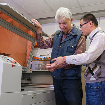 Two men using equipment