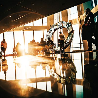 Guy in a suit using a touch board to track a chart