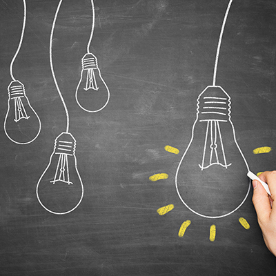 Blackboard with lightbulbs