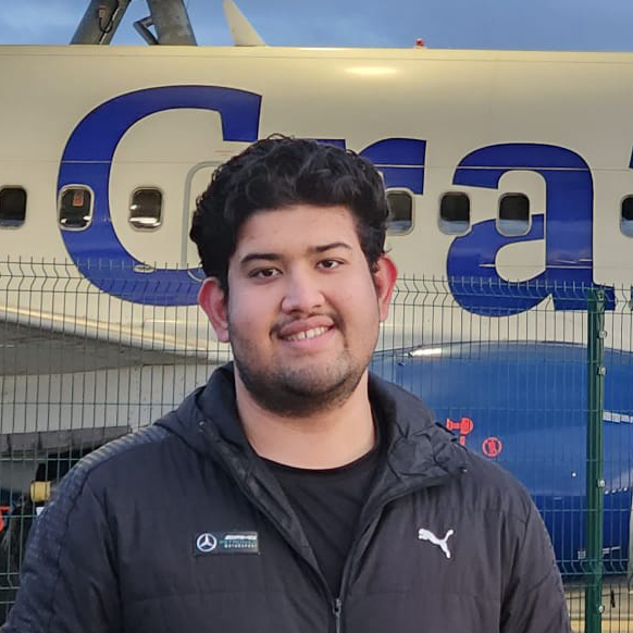 Advanced Heat Engineering MSc student Aditya Singh stood in front of the Cranfield Boeing 737